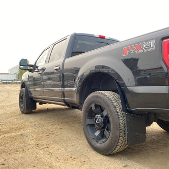 Gray Ford F-150 FX4 pickup truck on a dirt road