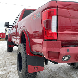 Red pickup truck with 'FX4' badge on a snowy ground
