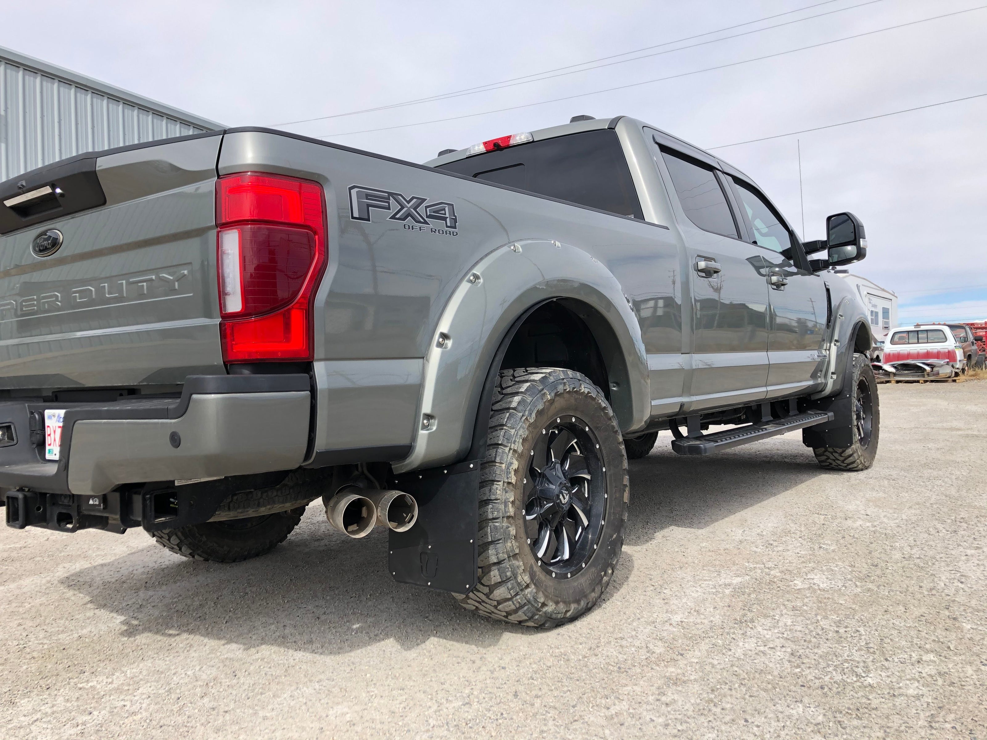 Gray Ford F-250 Super Duty truck with FX4 badge on a concrete surface.