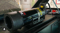 Image of a Jeep Wrangler JKU with a Diabolical, Inc. Slipstream security enclosure and foam deck pads with the Rail Rack accessory mount installed with a PowerTank installed..