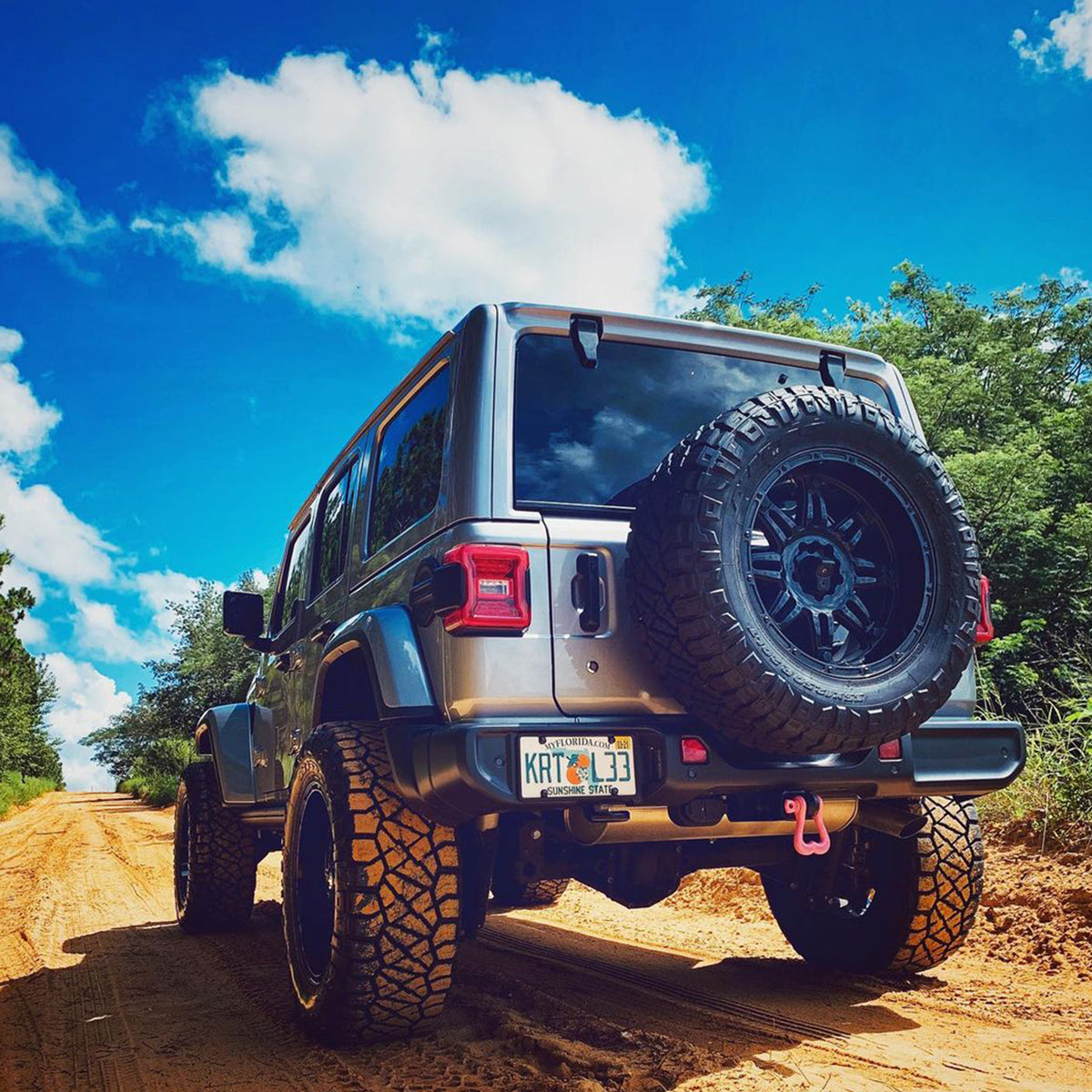 Pink Truck Nuts Shackle on a lifted 2018 Jeep Wrangler JL rear hitch soft shackle receiver